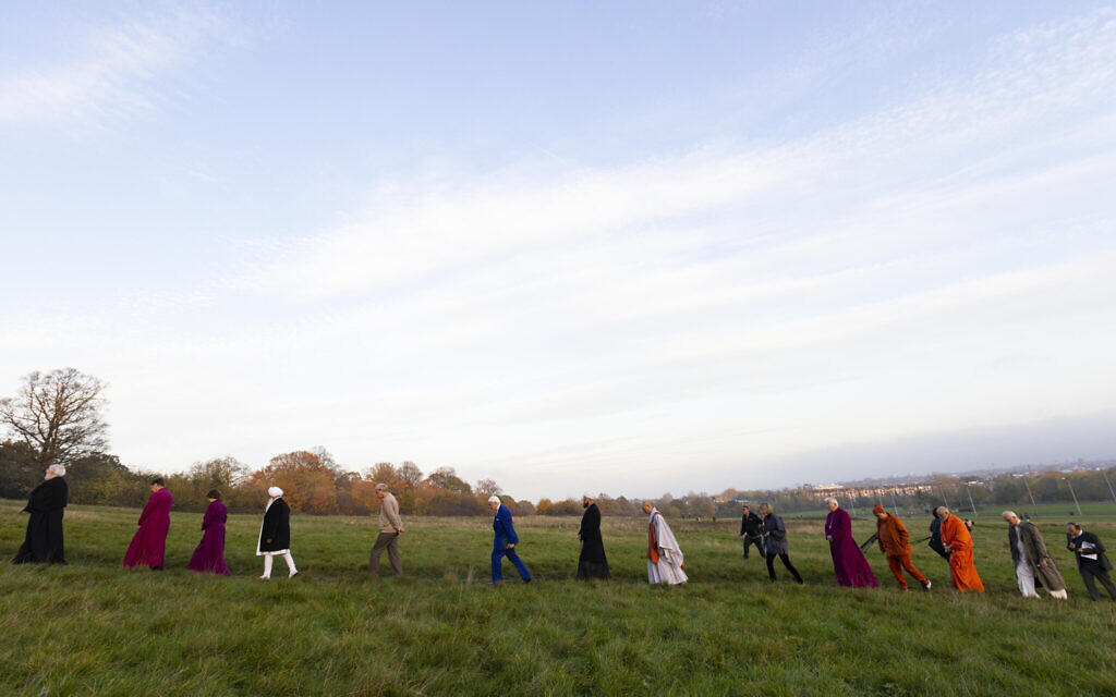 Archbishop Rowan Williams leads other world religious leaders gathered on Parliament Hill in London.