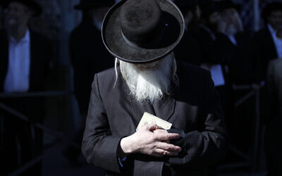 An Ultra-Orthodox Jewish man prays during a protest in Jerusalem. Photo: REUTERS/Ammar Awad