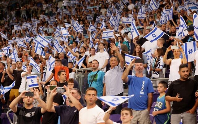 Israeli football fans cheer their national team
