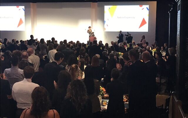 Nabila Espanioly receives a standing ovation as she accepts the Human Rights Awards. Picture: Twitter