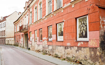 Vilnius, Lithuania - September 15, 2015: Photos discovered on the ruins of Vilnius jewish ghetto displayed in windows of a former ghetto House of cult.