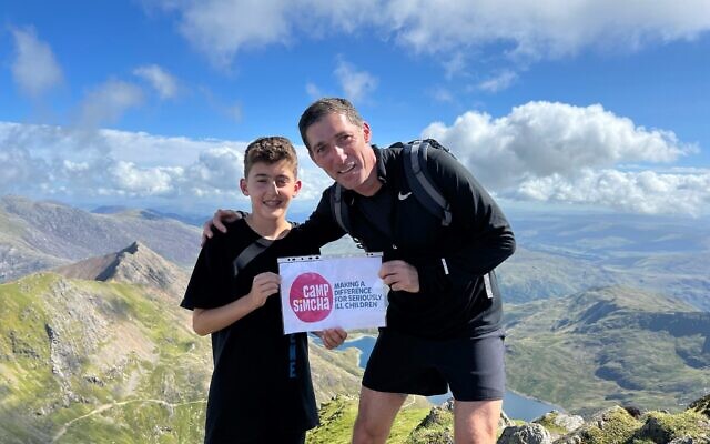 Sean Young with his dad James atop Mt. Snowden raising money for Camp Simcha