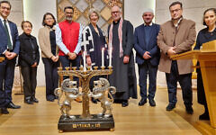 Rabbi Igor Zinkov, Mehri Niknam, Smita Oza, Ashwin Mehta, Dame Maureen Lipman DBE, Revd Graham Buckle, Imam Mehmed Stublla, Imam Rexhep Qerkezi and Rabbi Alexandra Wright with the LJS menorah (credit – Steven Derby/Interfaith Matters) Rabbi Igor Zinkov, Mehri Niknam, Smita Oza, Ashwin Mehta, Dame Maureen Lipman DBE, Revd Graham Buckle, Imam Mehmed Stublla, Imam Rexhep Qerkezi and Rabbi Alexandra Wright with the LJS menorah (credit – Steven Derby/Interfaith Matters)