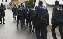 Police perform a raid on suspected members of the Reichsbürger far-right group in Saaldorf, Germany, Dec. 7, 2022. (Bodo Schackow/picture alliance via Getty Images)