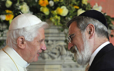 File photo dated 17/09/10 of Pope Benedict XVI meeting the then Chief Rabbi Jonathan Sacks at a meeting of religious leaders at St Mary's University College Chapel in Twickenham.