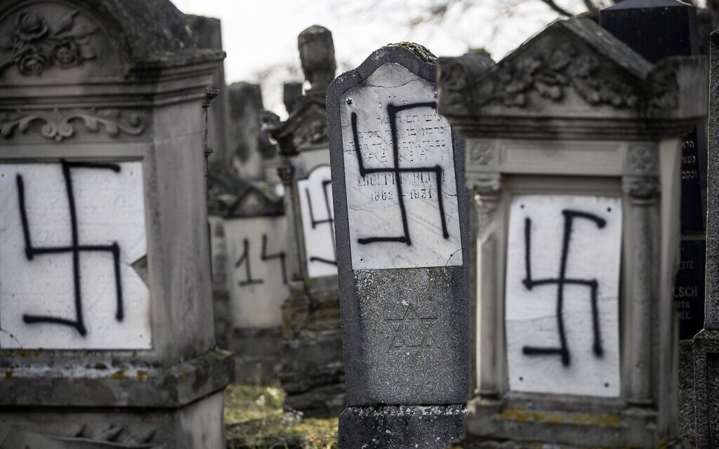 Graves daubed with swastikas