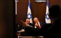 Israeli Prime Minister Benjamin Netanyahu sits with Interior and Health Minister Aryeh Deri at a weekly cabinet meeting at the Prime Minister's office in Jerusalem, January 8, 2023. REUTERS/Ronen Zvulun/Pool