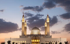 Grand mosque in Nizwa illuminated at night. Sultanate of Oman, Middle East