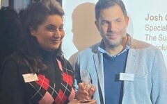 Justin Cohen receives award from BIJA committee member Reena Ranger.