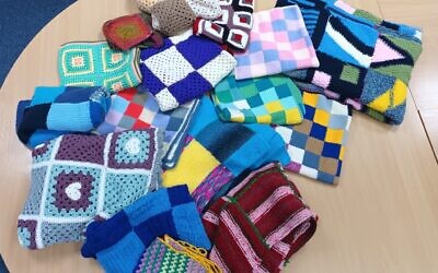 Blankets for the homeless in Manchester knitted by AJR Jewish refugees and volunteers for Jewish social action charity Mitzvah Day
