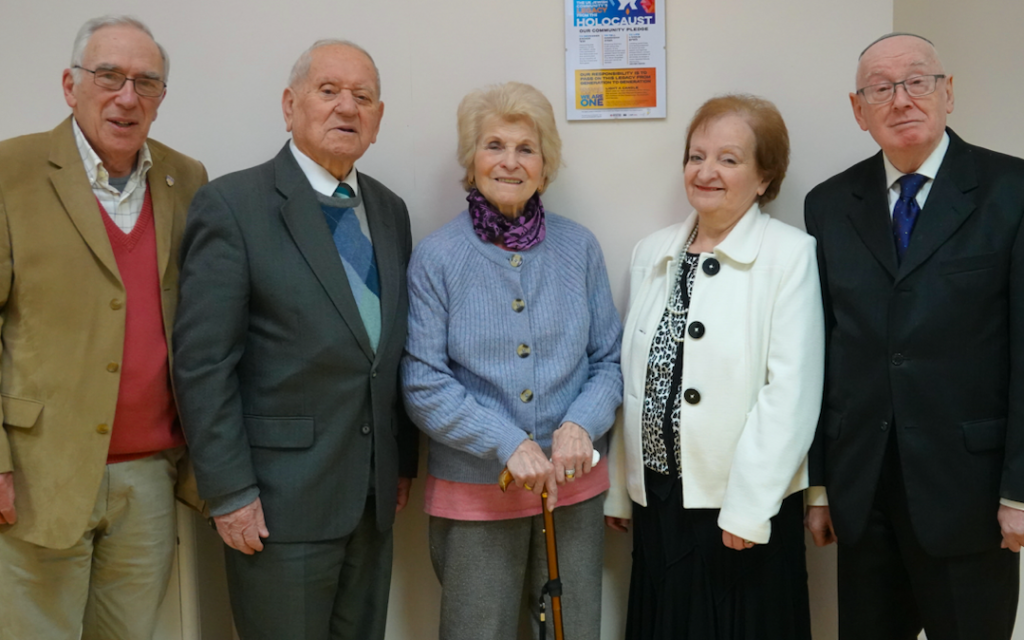 Photo: Deputy for Harrogate Hebrew Congregation Alan Sanders, Arek Hersh with his wife Jean, Roma Cohen (Vice President/Chair of Harrogate Hebrew Congregation) and Bernard Cohen (President of Harrogate Hebrew Congregation) standing in front of the Yom HaShoah Legacy Board