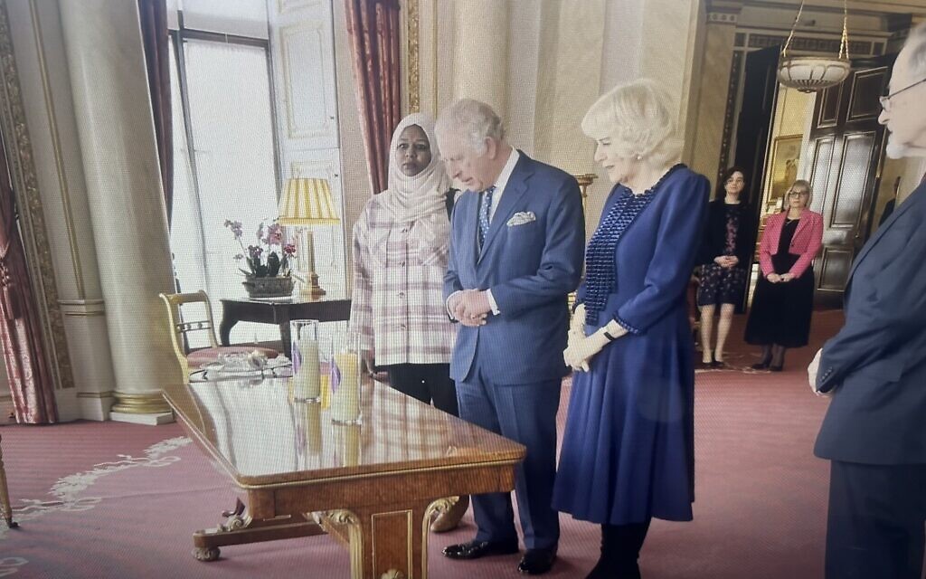 The King lit two candles in remembrance of victims of genocide to mark Holocaust Memorial Day.