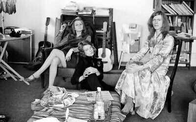 David Bowie, shown with his wife Angie at home in Kent, England, in 1971, is wearing a dress that he famously wore on the cover of his "The Man Who Sold the World" album. Credit: bowiesongs.wordpress.com