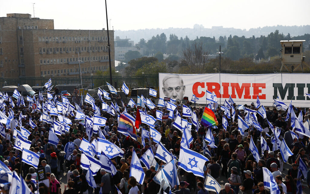 Israelis demonstrate on the day Israel's lawmakers start voting on a judicial plan that would give politicians more power on selecting judges while limiting Supreme Court powers to strike down legislation, outside the Knesset.