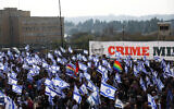 Israelis demonstrate on the day Israel's lawmakers start voting on a judicial plan that would give politicians more power on selecting judges while limiting Supreme Court powers to strike down legislation, outside the Knesset.