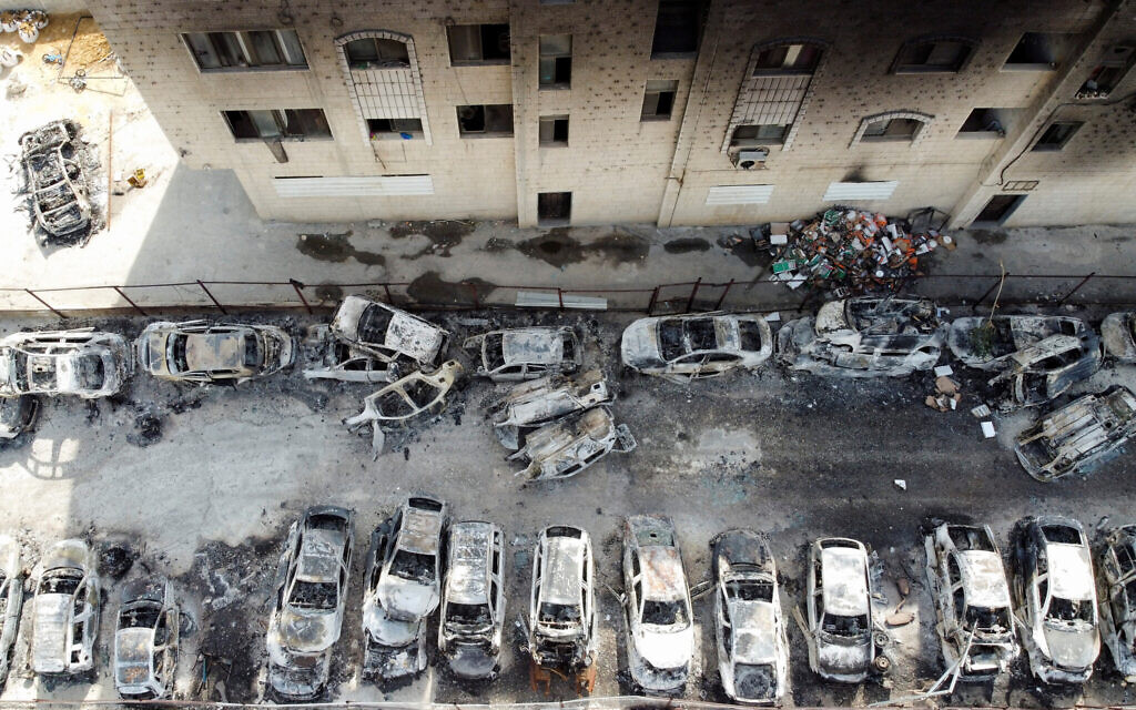 An aerial view shows a building and cars burnt in an attack by Israeli settlers near Hawara in 2023. REUTERS/Ammar Awad