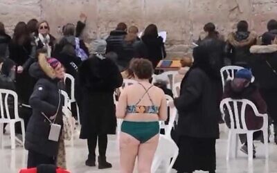A woman at the Western Wall protests a proposed 'immodesty' bill in Israel
