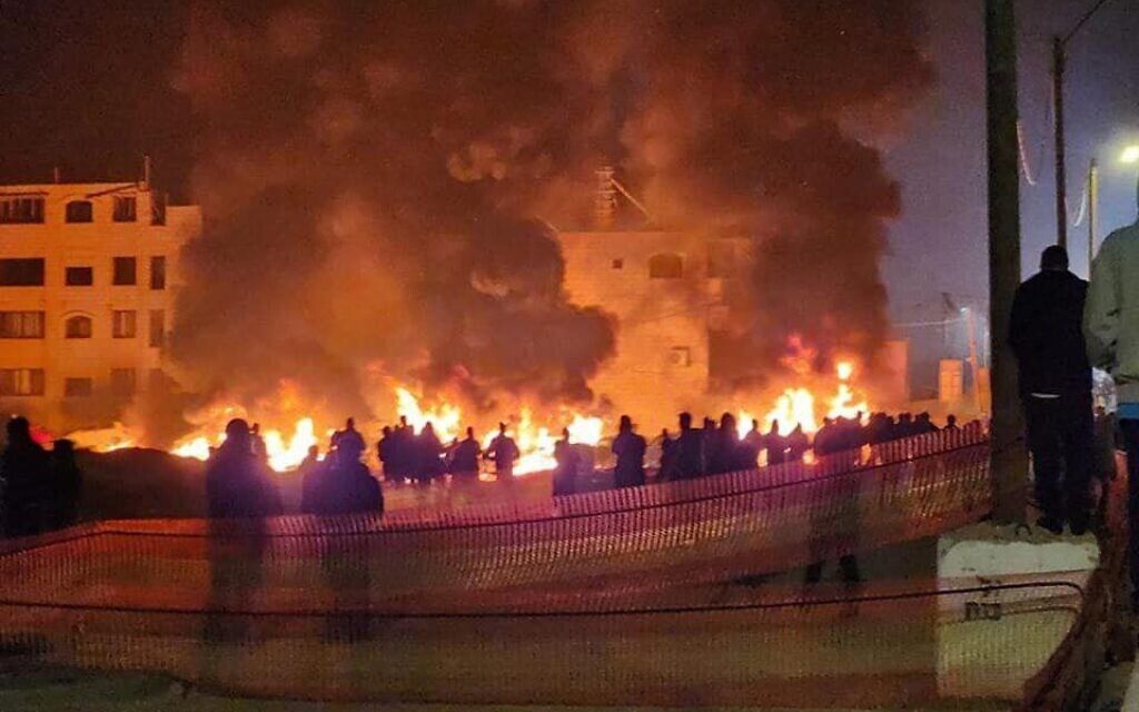 Settlers setting the Palestinian town of Huwara on fire, February 26 2023. Courtesy: Twitter.