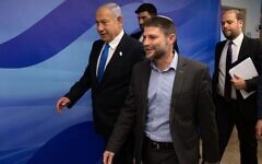 Israeli Prime Minister Benjamin Netanyahu and Minister of Finance Bezalel Smotrich arrive to a cabinet meeting on the state budget, at the Prime Minister's Office in Jerusalem. Israeli Prime Minister Benjamin Netanyahu and Minister of Finance Bezalel Smotrich arrive to a cabinet meeting on the state budget, at the Prime Minister's Office in Jerusalem.