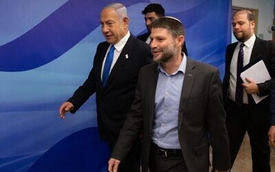 Israeli Prime Minister Benjamin Netanyahu and Minister of Finance Bezalel Smotrich arrive to a cabinet meeting on the state budget, at the Prime Minister's Office in Jerusalem.