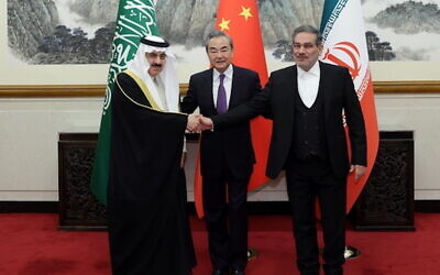 Saudi Arabia’s national security adviser Musaad bin Mohammed al-Aiban, left, Wang Yi, China’s top diplomat, and Ali Shamkhani, secretary of Iran’s Supreme National Security Council.
