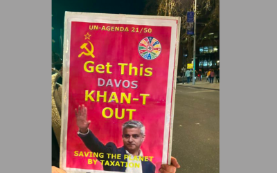 Banner with swastika on right corner featuring Mayor of London Sadiq Khan held by protestor outside event in Ealing