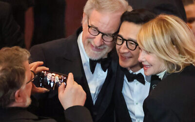 Steven Spielberg, who didn't win any Oscars, poses with Ke Huy Quan, who did, and Spielberg's wife Kate Capshaw at the 95th Academy Awards in the Dolby Theatre in Hollywood, California, March 12, 2023. (Myung J. Chun / Los Angeles Times via Getty Images)