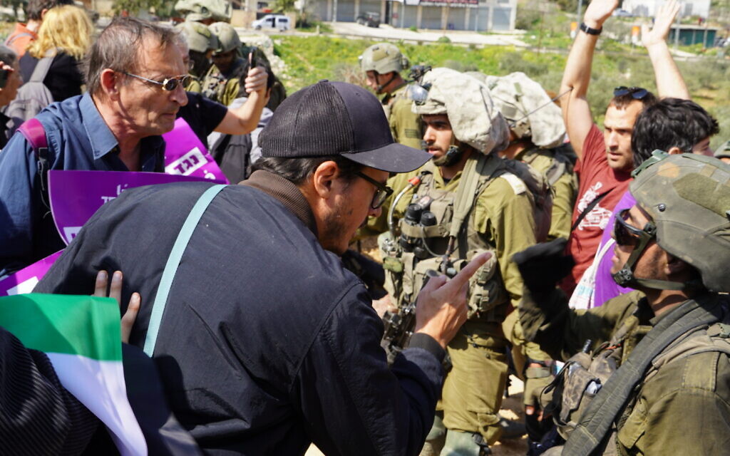 Some 400 Israeli demonstrators who marched toward the Palestinian town of Huwara on Friday, in an attempt to show solidity with the victims of a pogrom carried out by a mob of violent settlers the week before. Credit: Jotam Confino
