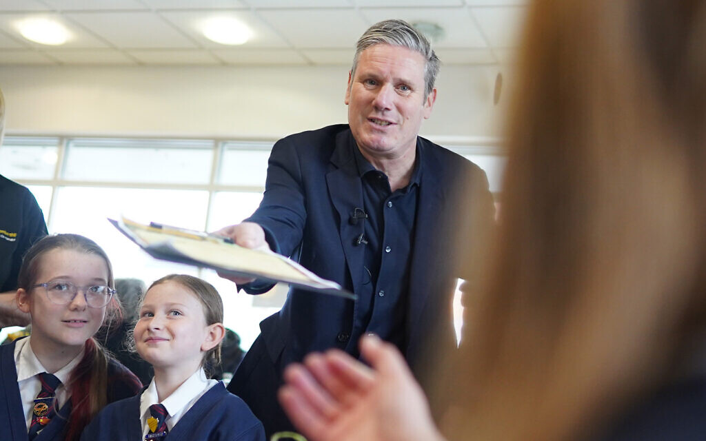 Labour Party leader Sir Keir Starmer with school children during a visit to a Co-op store in Ripley, Derbyshire, where he met local residents and shoppers ahead of the local elections on May 4.