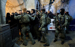 Israeli border policemen take position near Al-Aqsa compound also known to Jews as the Temple Mount, while tension arise during clashes with Palestinians in Jerusalem's Old City, April 5, 2023. REUTERS/Ammar Awad Israeli border policemen take position near Al-Aqsa compound also known to Jews as the Temple Mount, while tension arise during clashes with Palestinians in Jerusalem's Old City, April 5, 2023. REUTERS/Ammar Awad