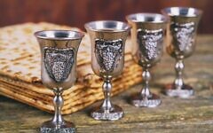 Red kosher four glasses wine with matzah and a Passover Haggadah Red kosher four glasses wine with matzah and a Passover Haggadah