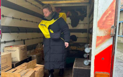 Lauren helping unload food and other supplies for migrants at the camp in Dunkirk