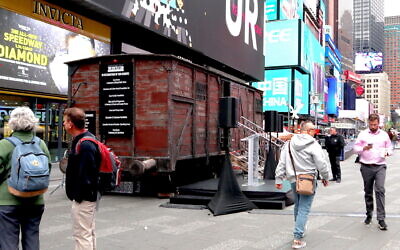 A replica of a Holocaust cattle car is on view in Times Square in honor of Yom Hashoah, April 18, 2023. (Julian Voloj)