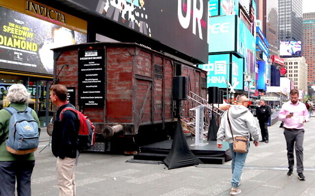 A replica of a Holocaust cattle car is on view in Times Square in honor of Yom Hashoah, April 18, 2023. (Julian Voloj)