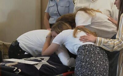 Maia and Rina Dee's siblings clutched their bodies at the funeral. Picture: Sky News