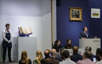 Sotheby's auctioneer Benjamin Doller takes bids on the Codex Sassoon in New York City on May 17, 2023. - (ANGELA WEISS / AFP)