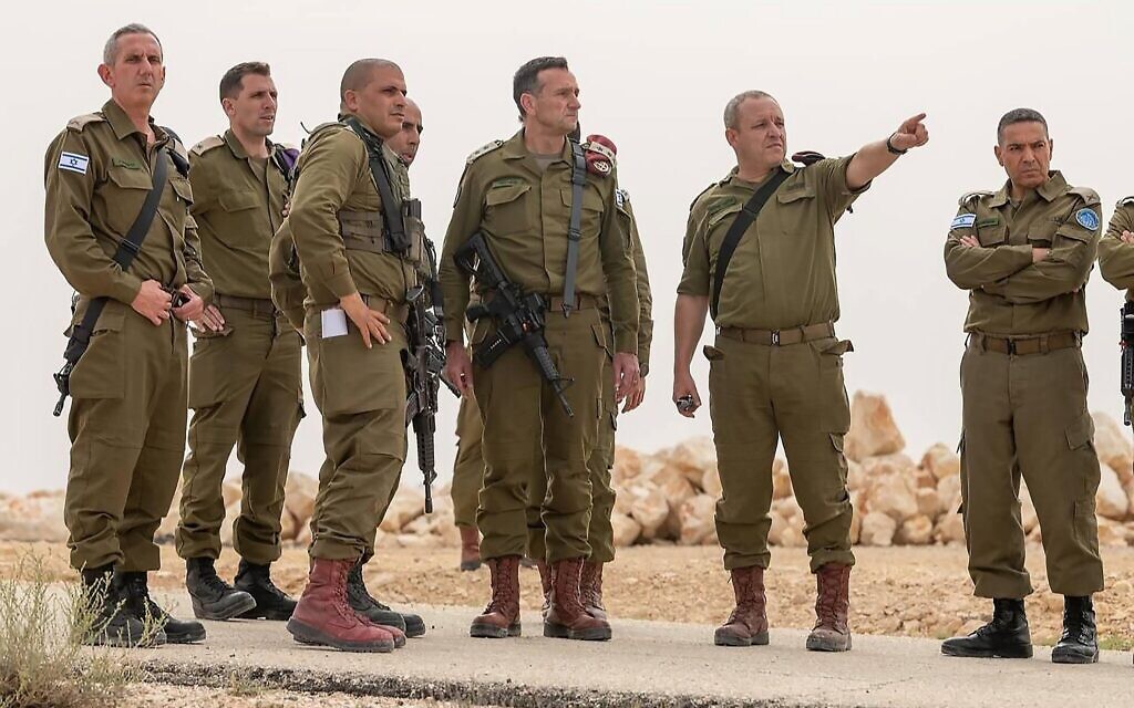 Herzi Halevi, the Chief of General Staff of the Israel Defense Forces, (C-R) inspects the area where three israeli soldiers were killed in an attack near the city of Mitzpe Ramon in Israel's southern Negev desert, adjacent to the border with Egypt, on June 3, 2023. Three Israeli soldiers were killed in an attack near Egypt's border after a gunman wearing an Egyptian police uniform opened fire, Israeli officials said. The Egyptian military said that, a gun battle ensued when a member of the Egyptian security forces crossed the security fence with Israel during a chasing of drug smugglers. Photo
