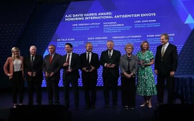 Lord Mann, (fourth right) amongst those honoured by AJC