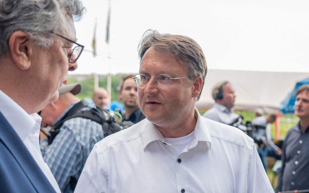 Robert Sesselmann, in white, attends an AfD election event in Sonneberg, eastern Germany, June 25, 2023. (Ferdinand Merzbach/News5/AFP via Getty Images)