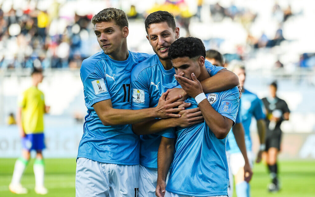 Hamza Shibli, right, celebrates with teammates after scoring against Brazil in a FIFA U-20 World Cup match in Estadio San Juan in San Juan, Argentina, June 3, 2023. (Marcelo Endelli/FIFA via Getty Images)