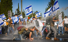 Anti-government protestors outside the Knesset. Photo by Chaim Goldberg/Flash90