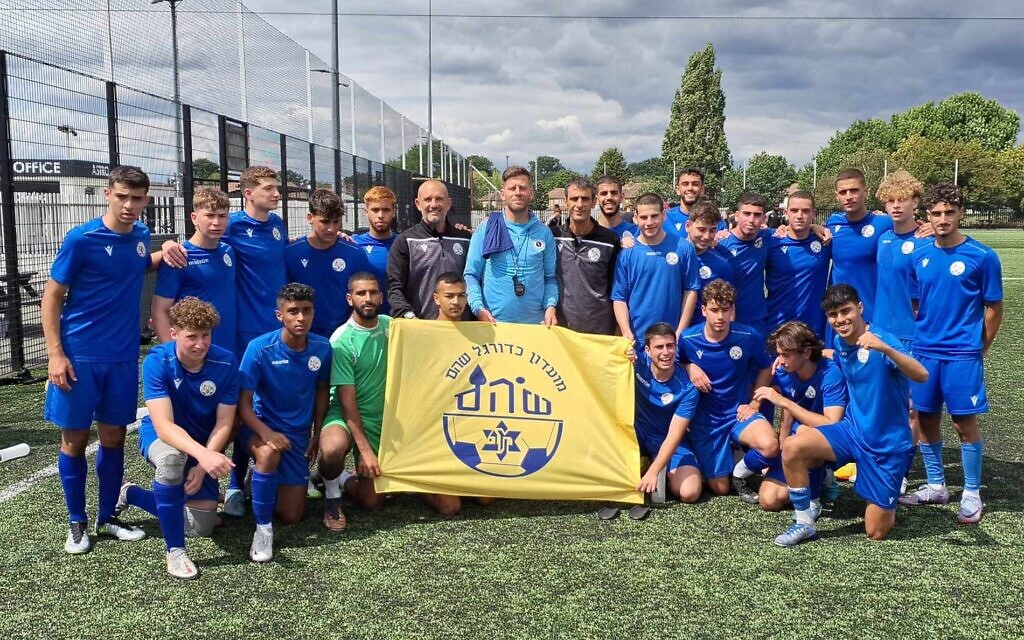 Israel's Shoham squad with Borehamwood FC manager Luke Garrard