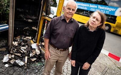 Konrad Kutt and Irena Aselmeier, founders of Germany's book box initiative, stand in front of the burned-out book box near the "Gleis 17" Holocaust memorial after an apparent arson attack. (Fabian Sommer/picture alliance via Getty Images)