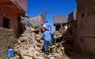 A man wearing a traditional Moroccan dress is seen walking among debris from destroyed houses in the historic town in the aftermath of the earthquake. The 6.8 magnitude earthquake hit on Friday 8th September 70 km south of Marrakesh and was one of the strongest and deadliest in the Morocco's history, with a death toll of more than 2000 people and thousands of wounded. (Credit Image: © Davide Bonaldo/SOPA Images via ZUMA Press Wire) EDITORIAL USAGE ONLY! Not for Commercial USAGE!