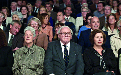 Winton, played by Anthony Hopkins,  in the front row of the TV audience surrounded by “his children”.