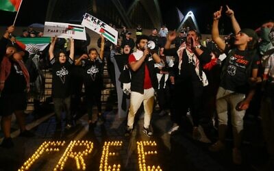 Pro-Palestinian protesters rally outside the Sydney Opera House, Oct. 9, 2023. (Lisa Maree Williams/Getty Images) via JTA