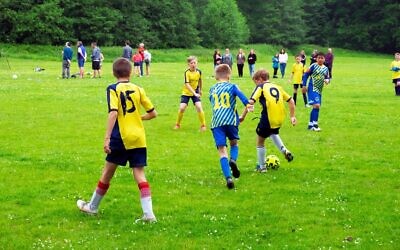 File image of boys playing football. None of the players in this picture are related to the incident described.