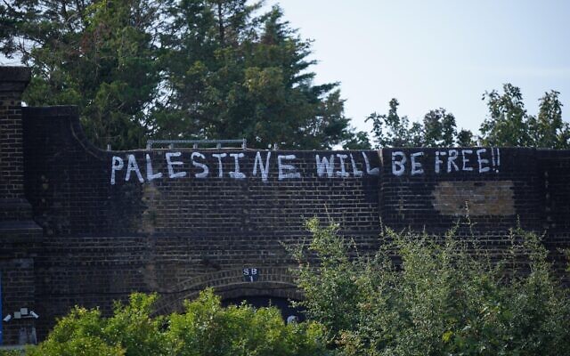 Pro Palestinian graffiti sprayed on a railway bridge in Golders Green, north London. Monday October 9, 2023.