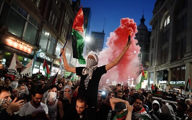 People take part in a Palestine Solidarity Campaign demonstration near the Israeli Embassy, in Kensingston, London,just 72 hours after the Hamas attack.