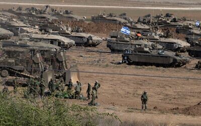 Armoured personnel carriers and tanks in a staging area in southern Israel. Photo by Jim Hollander/UPI Credit: UPI/Alamy